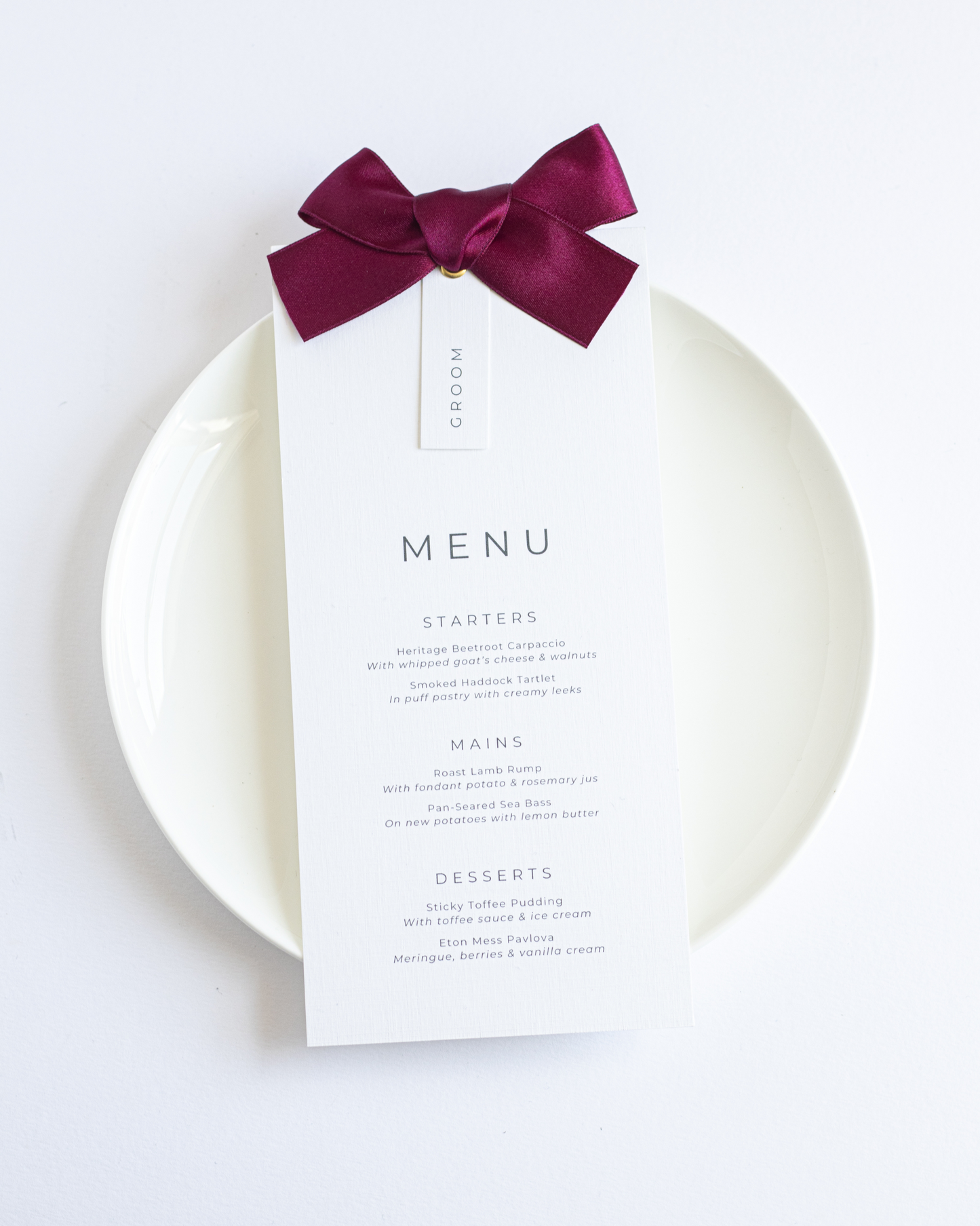 Burgundy Ribbon wedding menu with satin ribbon and neutral place setting