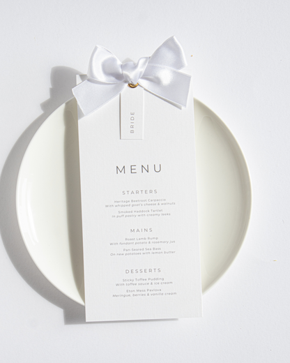 Wedding menu card with a white bow on a white background